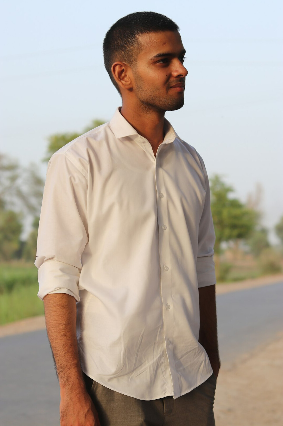 Portrait of a man with short hair in a casual shirt