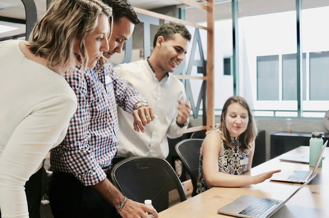 manager leading team meeting