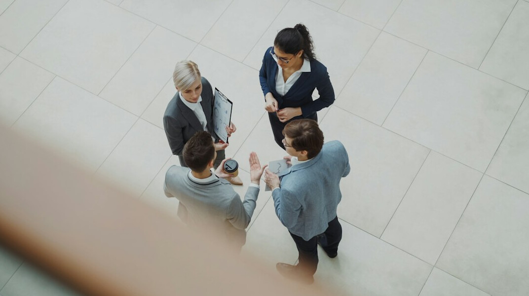 business manager leading team meeting